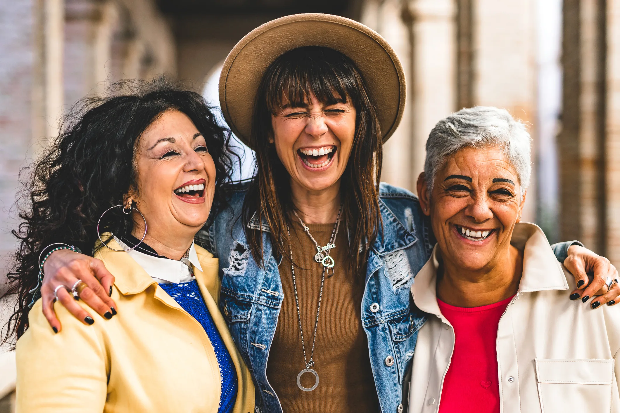 Three women laughing together